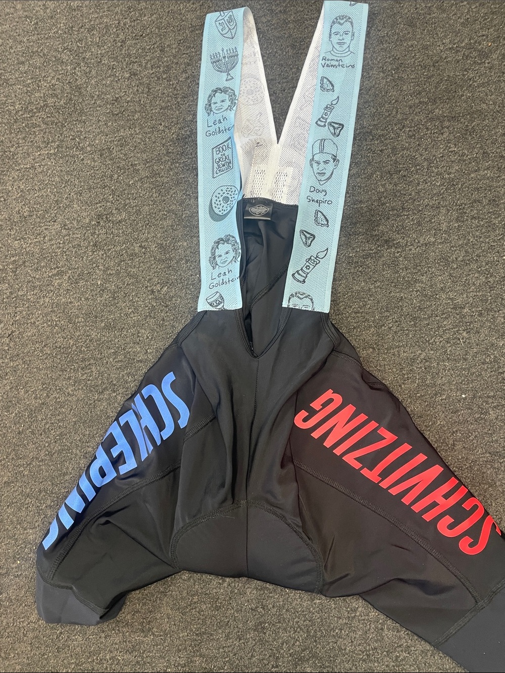 Ostroy OY Schvitzing Men’s Black Cycling Bib Shorts with Blue & Red Accents